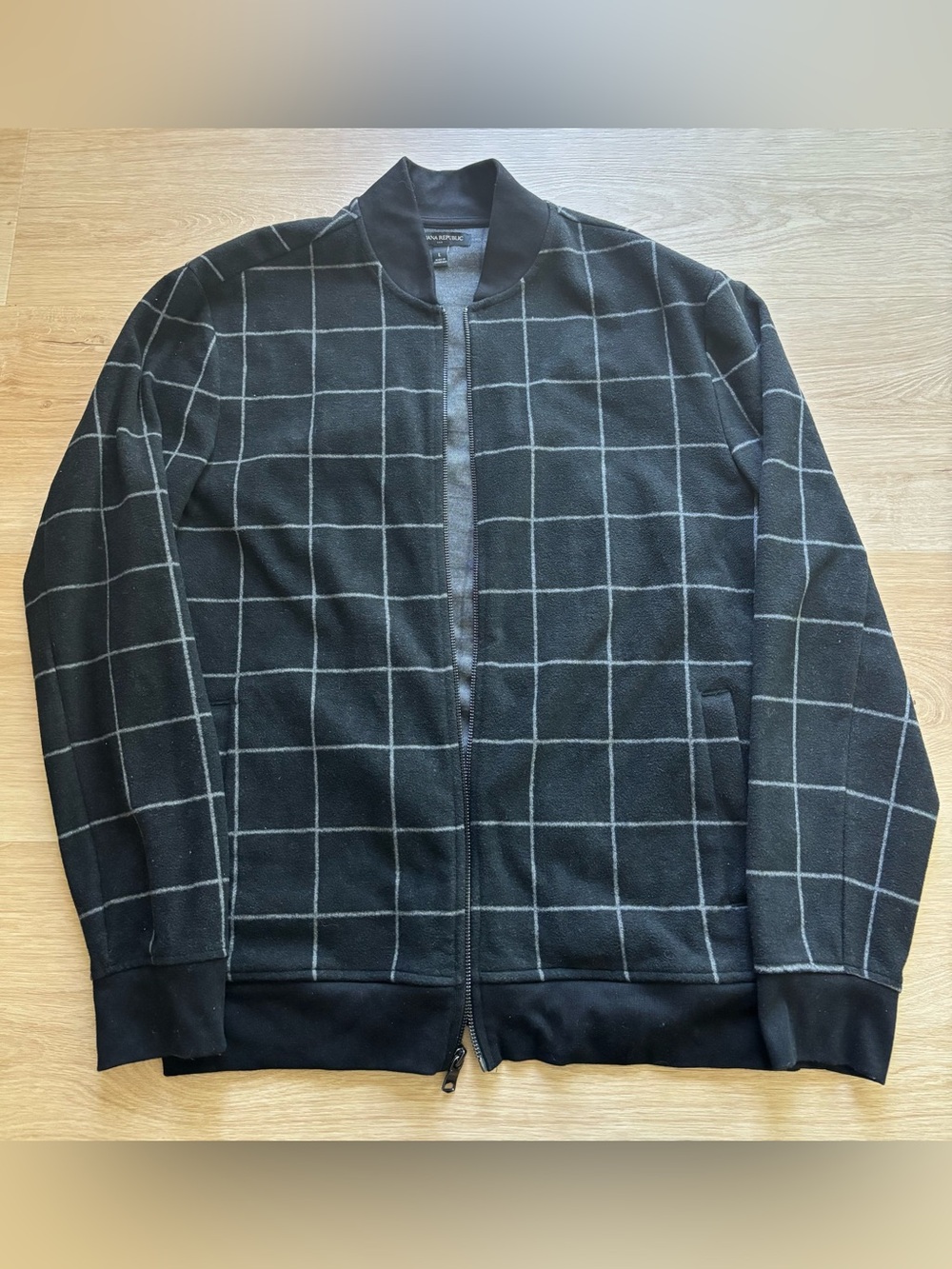 Banana Republic black and white checkerboard zip up jacket.  Size large.